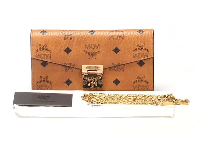 Cartera MCM Visetos en cadena de cuero, cartera larga en muy buen estado 